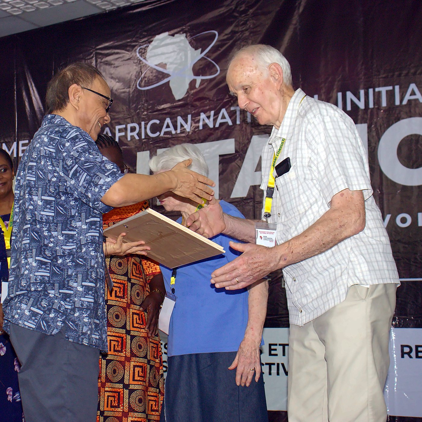A presentation on stage at the MANI 2026 consultation, Abidjan